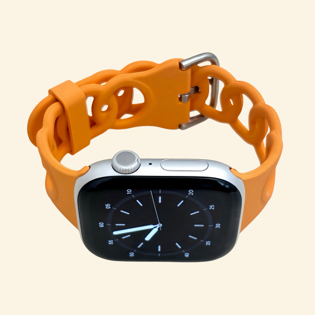 Vibrant Orange Cutout Chain Link Silicone Band — front face view on Apple Watch
