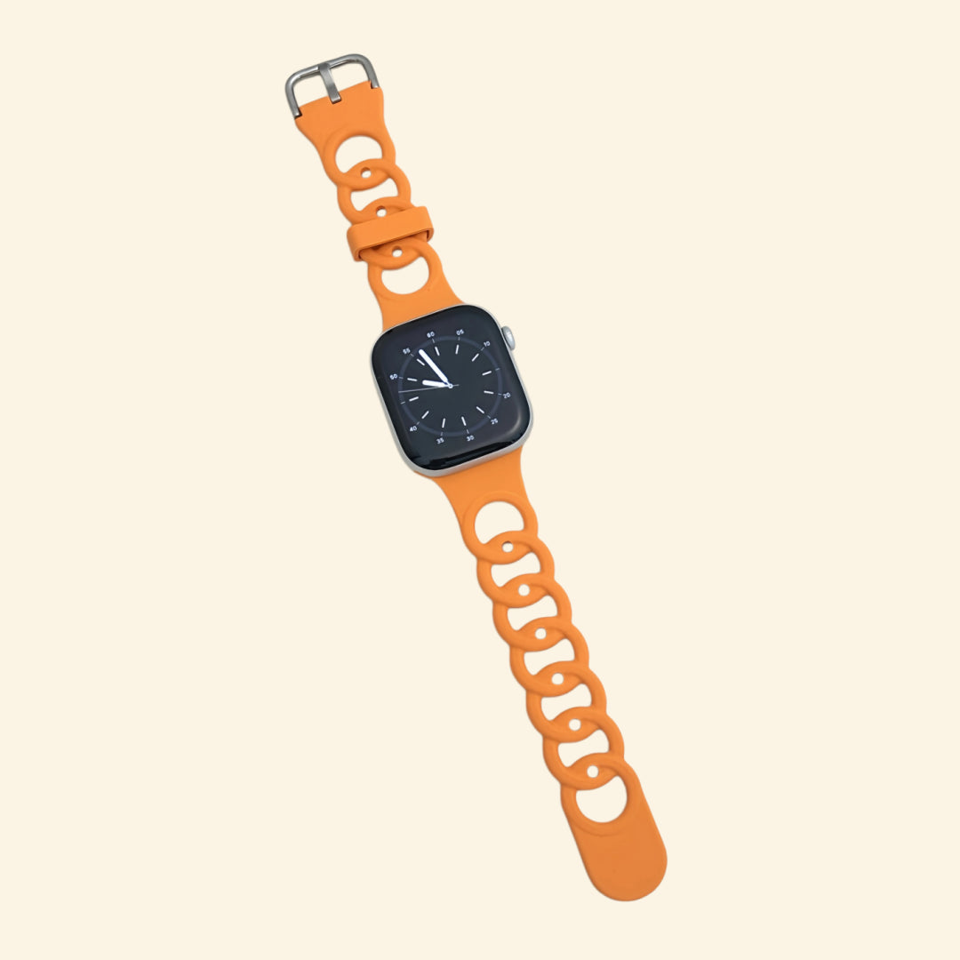 Vibrant Orange Cutout Chain Link Silicone Band — flat lay showing full strap length and chain link detail