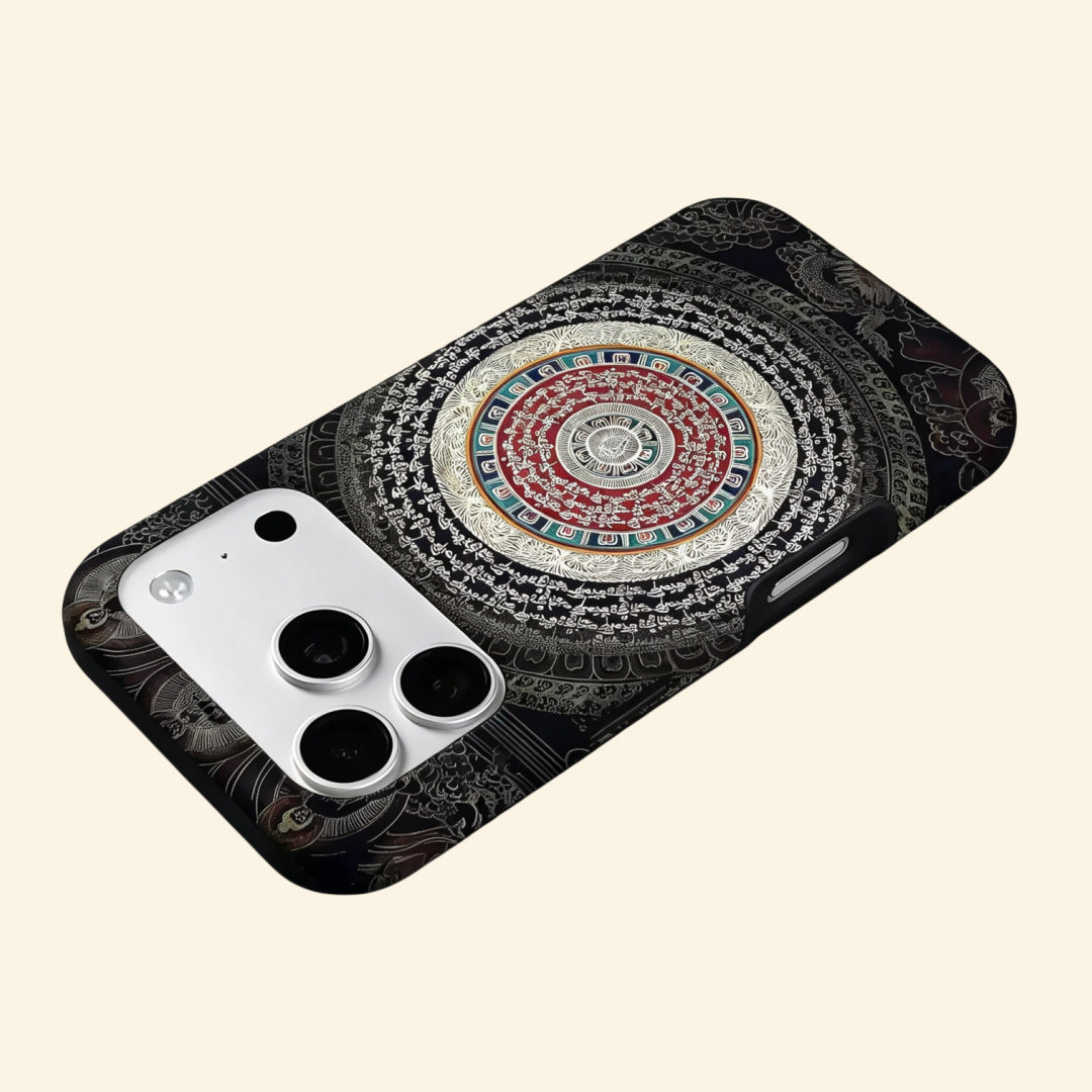 The Sacred Mandala case – low-angle floating view showing golden script and crimson mandala rings