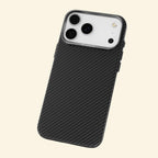 Specimen No. 10549 — Zero-Gravity™ Ultra-Slim Aramid Case for iPhone - Carapace StudioiPhone CaseCarapace StudioCarapace StudioCS-10549-ZG-BLACKiPhone 17 Pro MaxSpecimen No. 10549 Zero-Gravity Aramid iPhone Case — silver camera bezel close-up