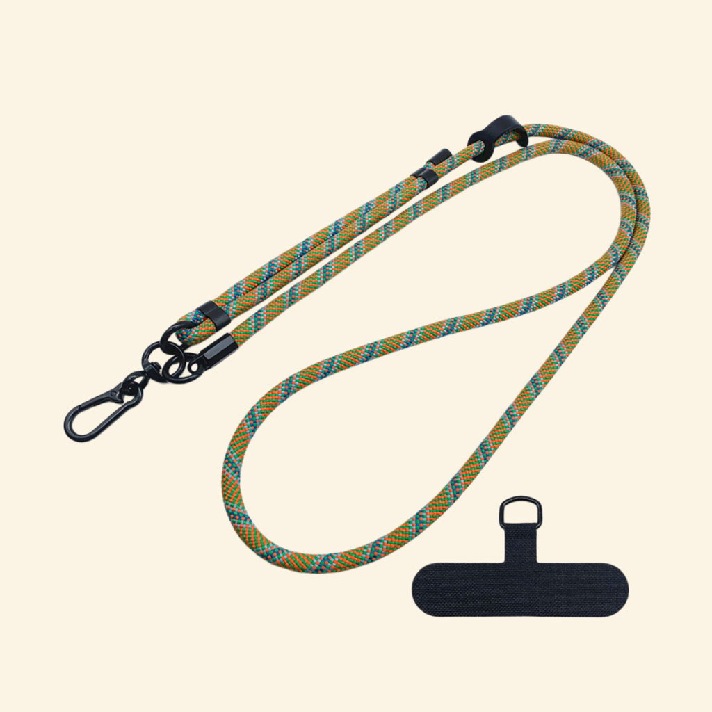 The Core Cord Amber & Teal Cross-Weave – lanyard with tether pad flat lay