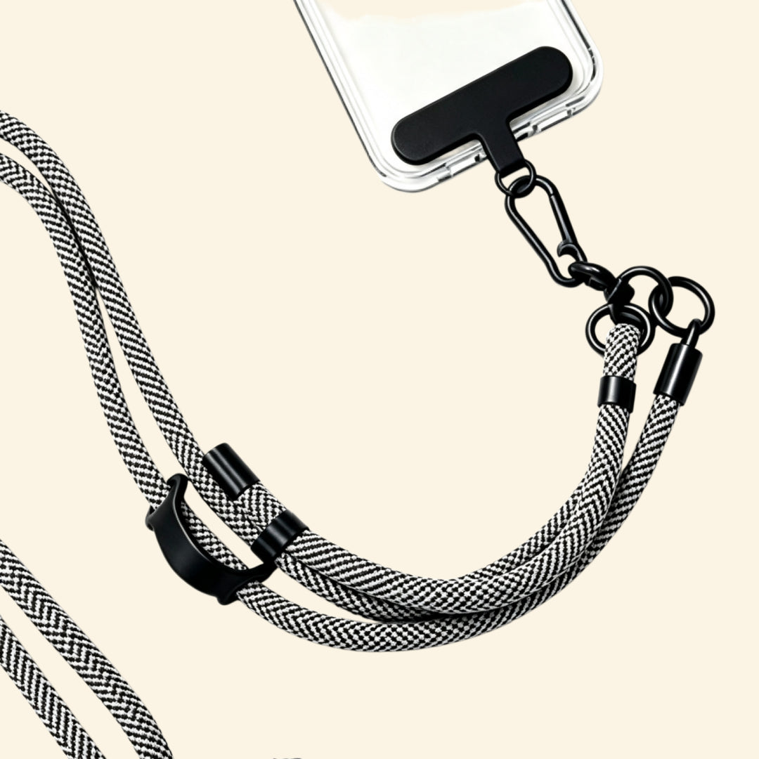 The Core Cord Monochrome Zebra Stripe – lanyard attached to phone case detail view