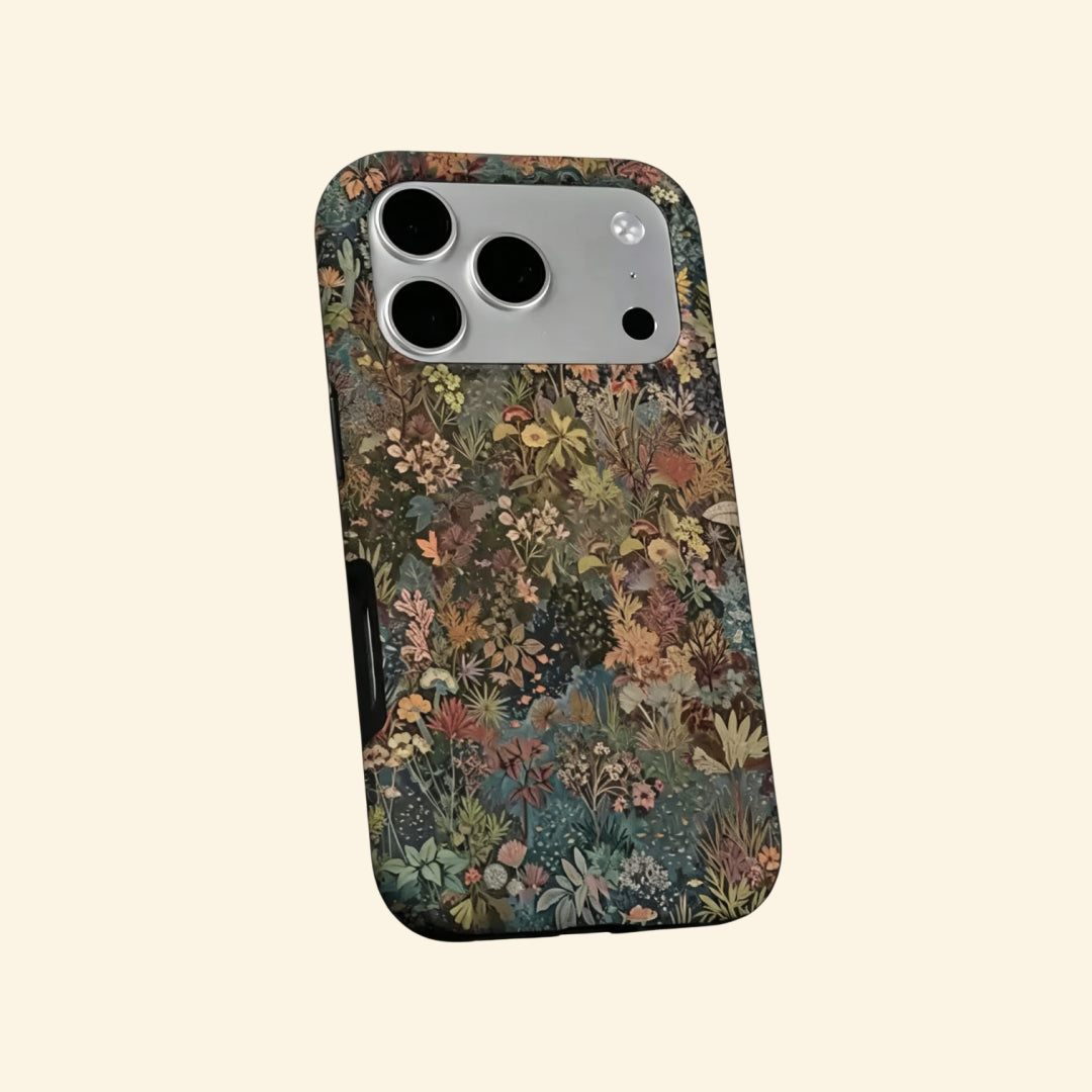 The Nocturnal Flora case – hand-held lifestyle shot showing full vintage botanical tapestry artwork