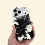 The Ink Flower case – low-angle top-down view showing camera island and swirling ink petal detail