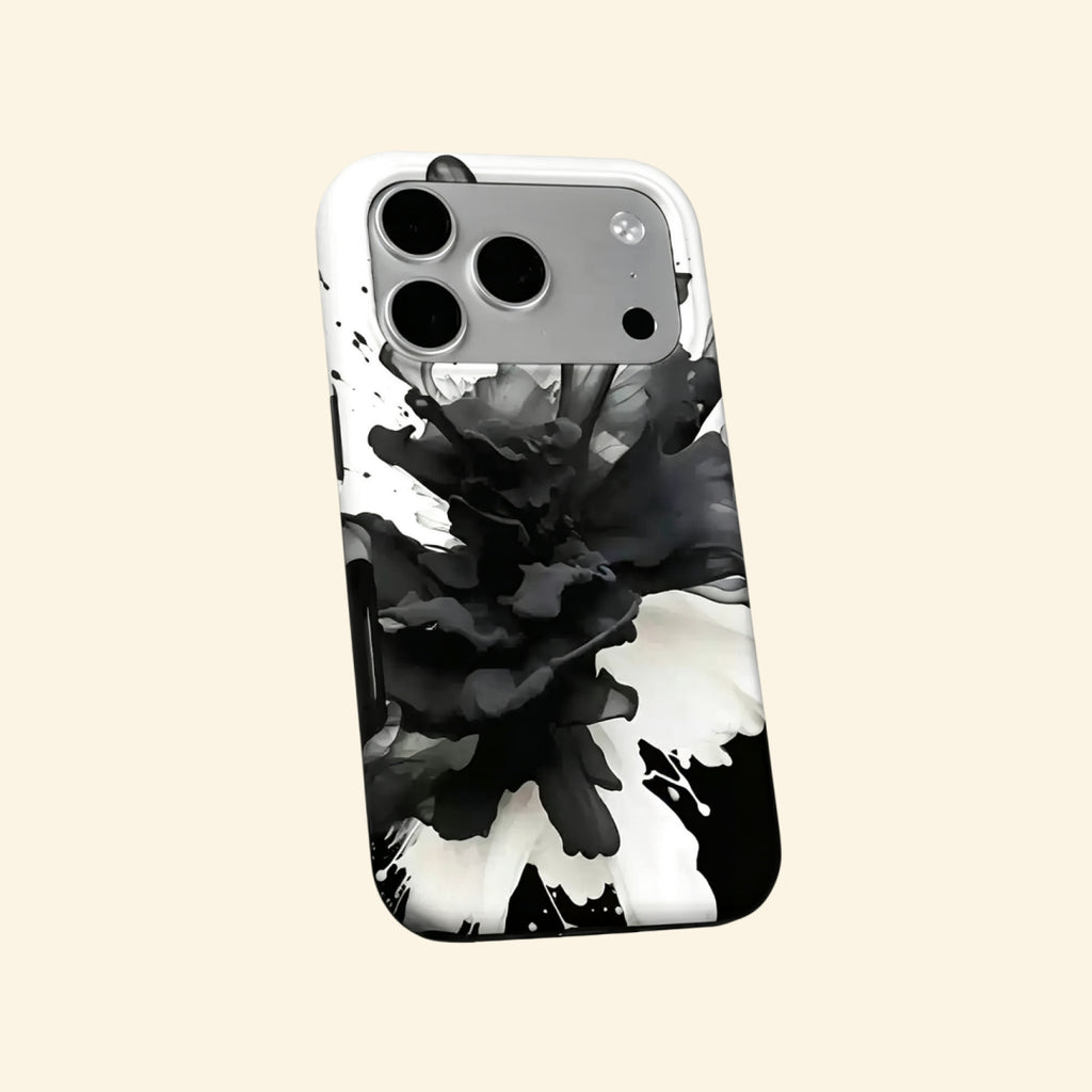 The Ink Flower case – hand-held lifestyle shot showing full black ink smoke bloom artwork