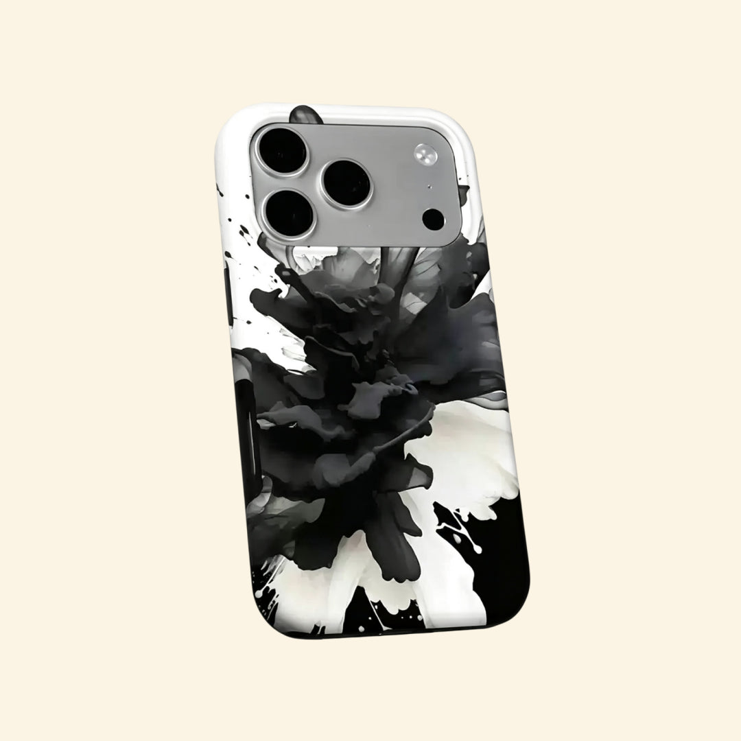 The Ink Flower case – hand-held lifestyle shot showing full black ink smoke bloom artwork
