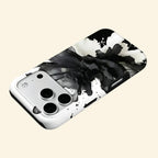 The Ink Flower case – floating side angle showing high-contrast monochrome ink bloom and dual-layer construction