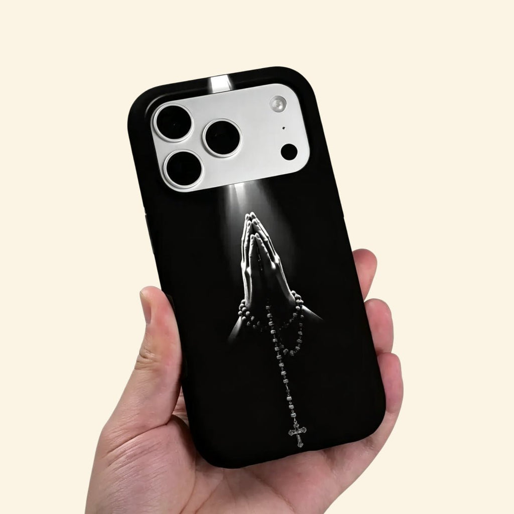 The Sacred Beam – Praying Hands & Rosary Cross Fine Art iPhone Case - Carapace StudioPhone CaseCarapace StudioCarapace StudioCS-3020-SACRED-BEAM-5iPhone 16 Pro MaxThe Sacred Beam case – low-angle top-down view showing camera island and praying hands with rosary detail