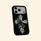 The Devotional Emblem case – floating side angle showing ornate cross detail and dual-layer matte black shell