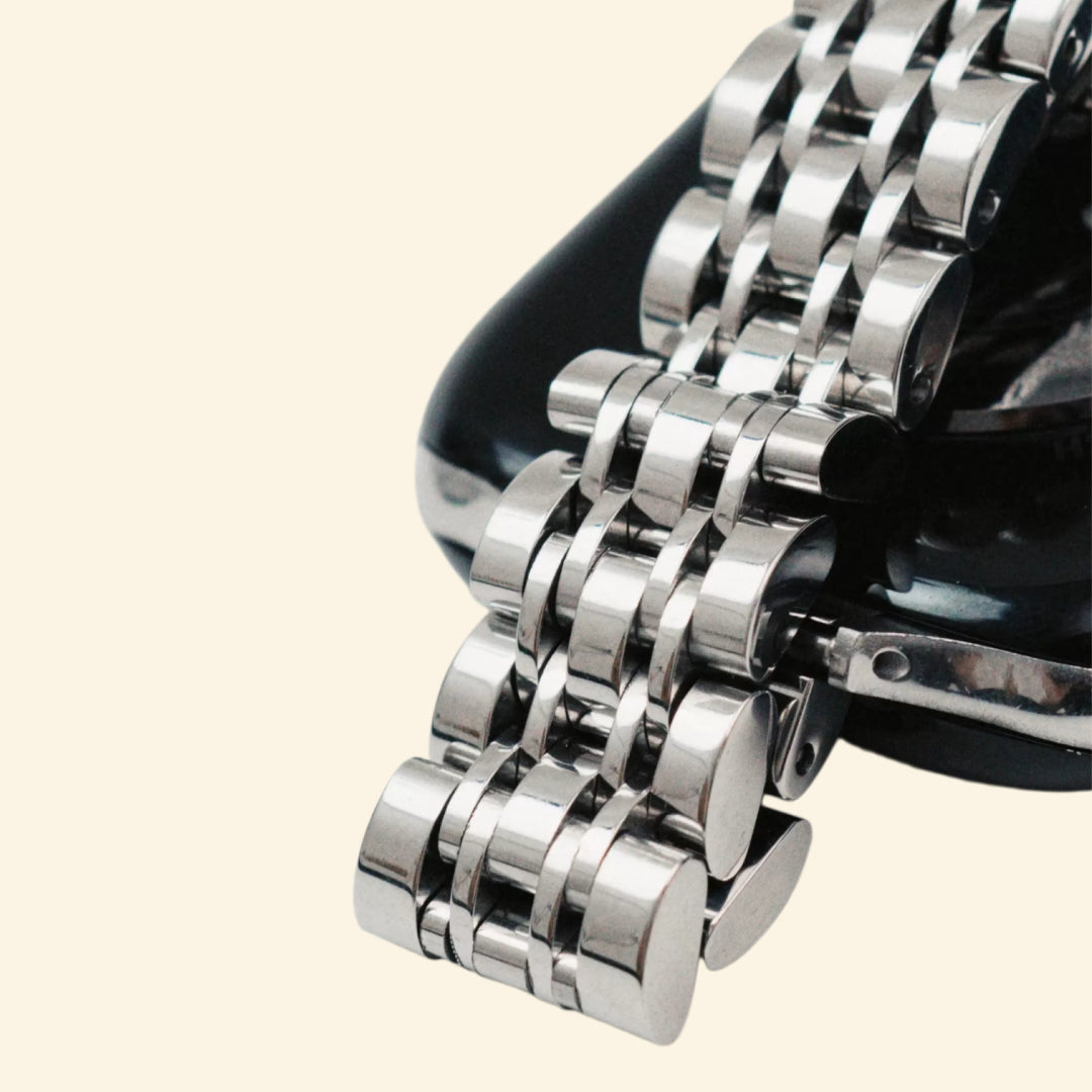 Silver Jubilee Band — close-up five-link and butterfly clasp detail