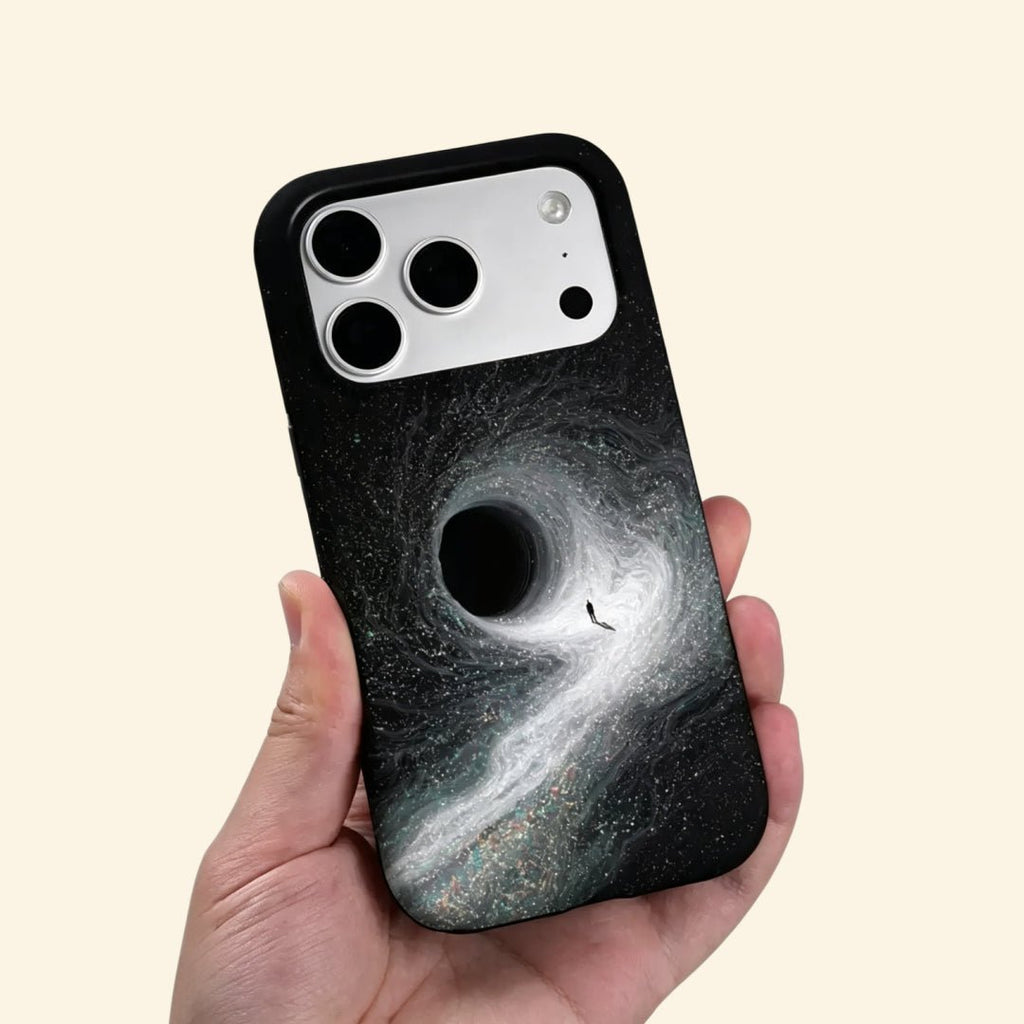 The Singularity – Black Hole Event Horizon & Cosmic Wanderer iPhone Case - Carapace StudioPhone CaseCarapace StudioCarapace StudioCS-3323-SINGULARITY-5iPhone 16 Pro MaxThe Singularity case – second angled floating view showing full gravitational vortex and stardust texture detail