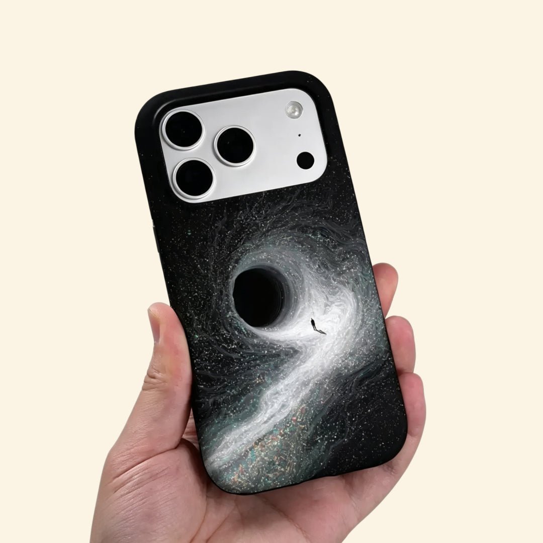 The Singularity – Black Hole Event Horizon & Cosmic Wanderer iPhone Case - Carapace StudioPhone CaseCarapace StudioCarapace StudioCS-3323-SINGULARITY-5iPhone 16 Pro MaxThe Singularity case – second angled floating view showing full gravitational vortex and stardust texture detail