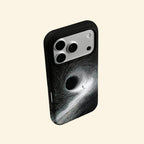 The Singularity – Black Hole Event Horizon & Cosmic Wanderer iPhone Case - Carapace StudioPhone CaseCarapace StudioCarapace StudioCS-3323-SINGULARITY-5iPhone 16 Pro MaxThe Singularity case – low-angle side view showing camera island and black hole swirl from below