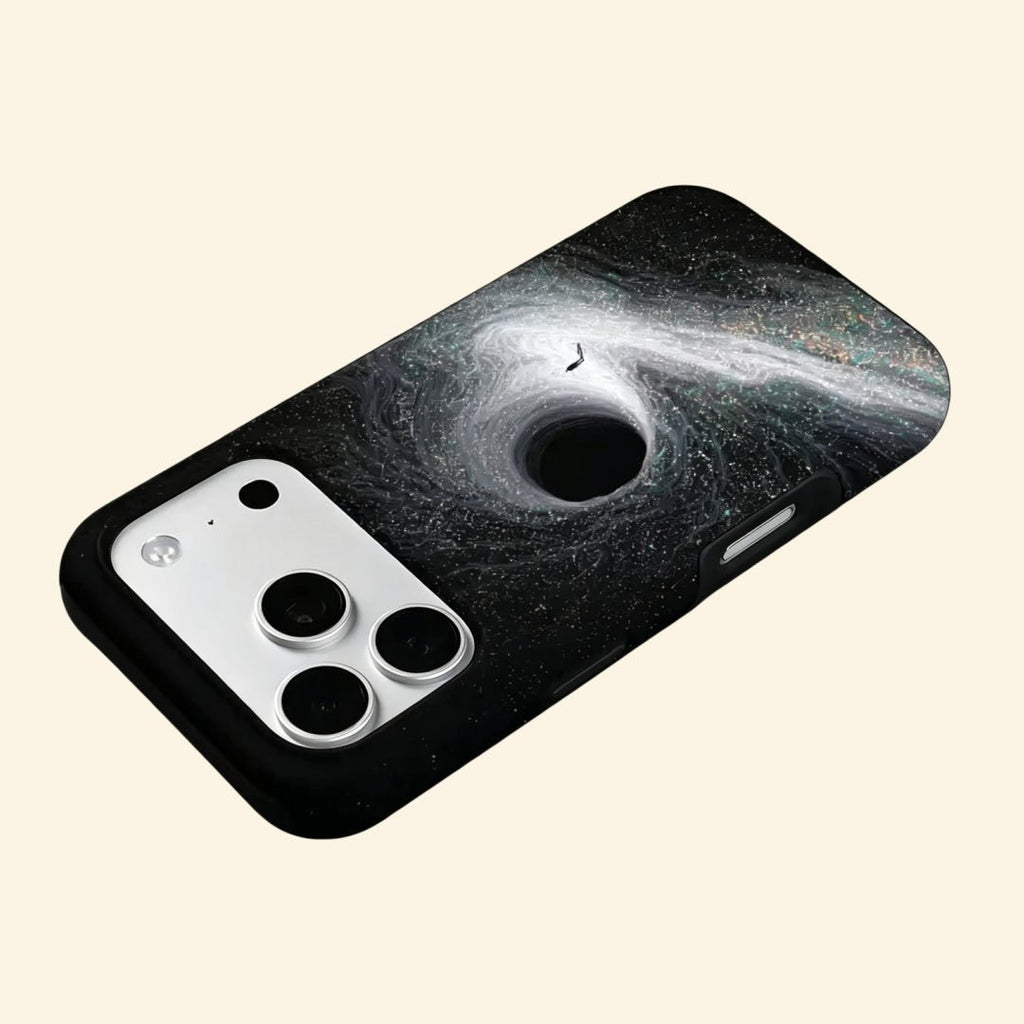 The Singularity – Black Hole Event Horizon & Cosmic Wanderer iPhone Case - Carapace StudioPhone CaseCarapace StudioCarapace StudioCS-3323-SINGULARITY-5iPhone 16 Pro MaxThe Singularity case – hand-held lifestyle shot showing full black hole event horizon and solitary figure artwork