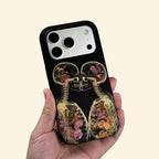 The Eternal Embrace – Kissing Skeletons & Botanical X-Ray iPhone Case - Carapace StudioPhone CaseCarapace StudioCarapace StudioCS-3424-ETERNAL-EMBRACE-5iPhone 16 Pro MaxThe Eternal Embrace case – low-angle side view showing camera island and kissing skeleton X-ray detail