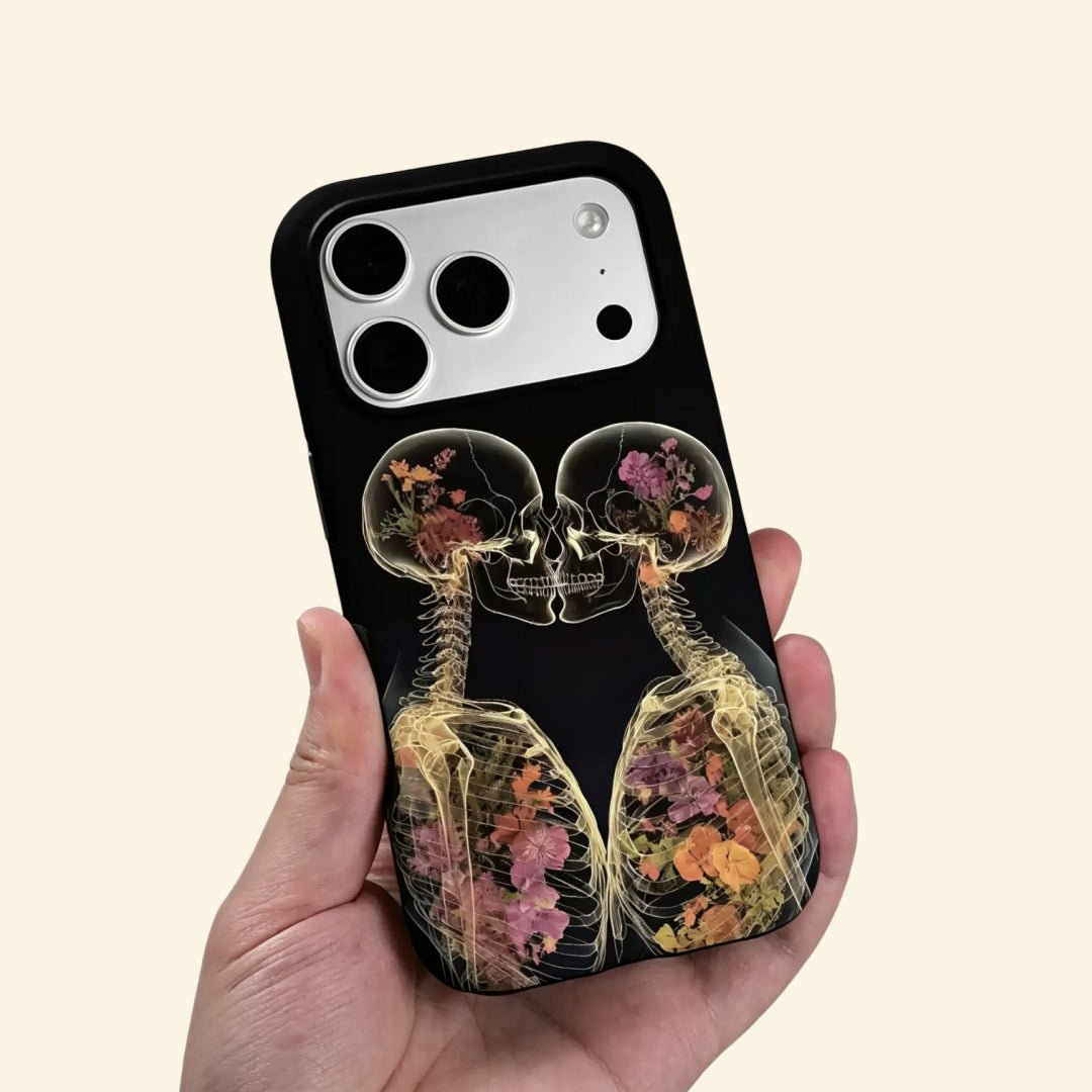 The Eternal Embrace – Kissing Skeletons & Botanical X-Ray iPhone Case - Carapace StudioPhone CaseCarapace StudioCarapace StudioCS-3424-ETERNAL-EMBRACE-5iPhone 16 Pro MaxThe Eternal Embrace case – low-angle side view showing camera island and kissing skeleton X-ray detail