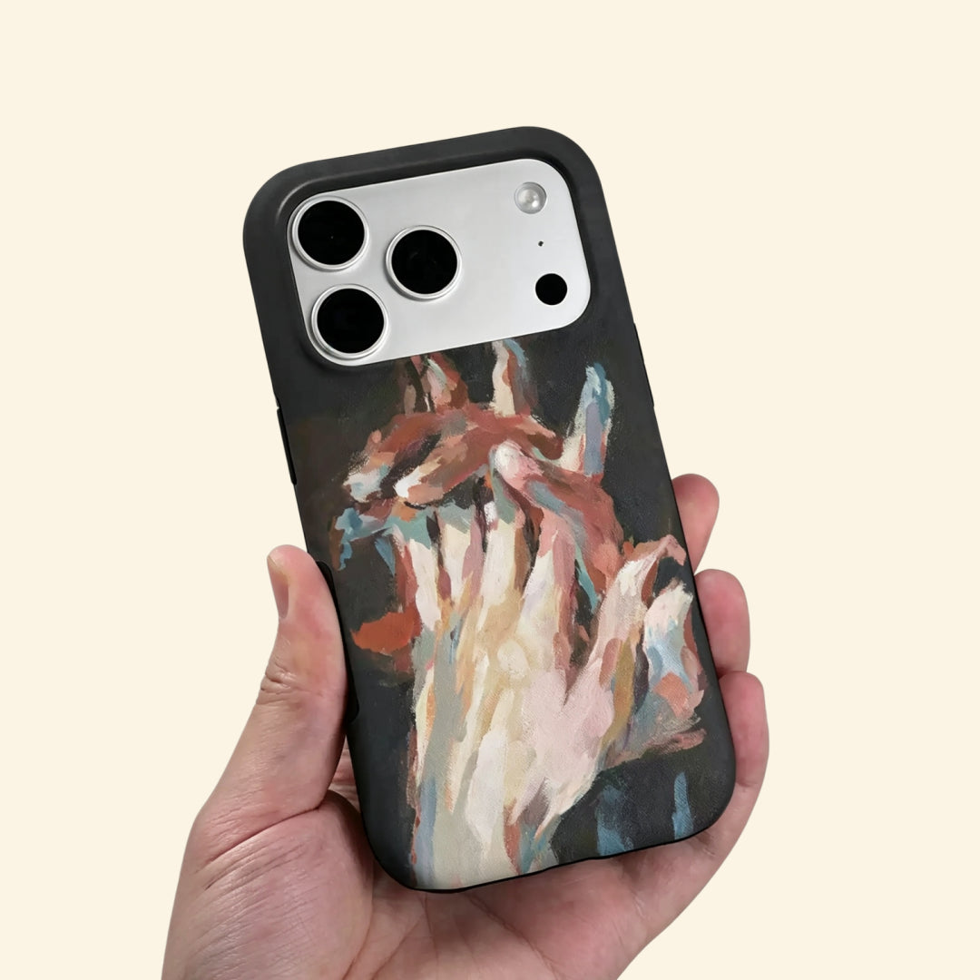 The Silent Touch case – low-angle top-down view showing camera island and intertwined hands brushstroke detail