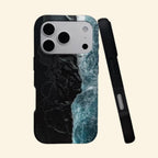 The Basalt Shore – Volcanic Black Sand & Ice-Blue Sea iPhone Case - Carapace StudioPhone CaseCarapace StudioCarapace StudioCS-3626-BASALT-SHORE-1iPhone 17 Pro MaxThe Basalt Shore case – angled floating view showing aerial volcanic black sand beach with crashing ice-blue waves