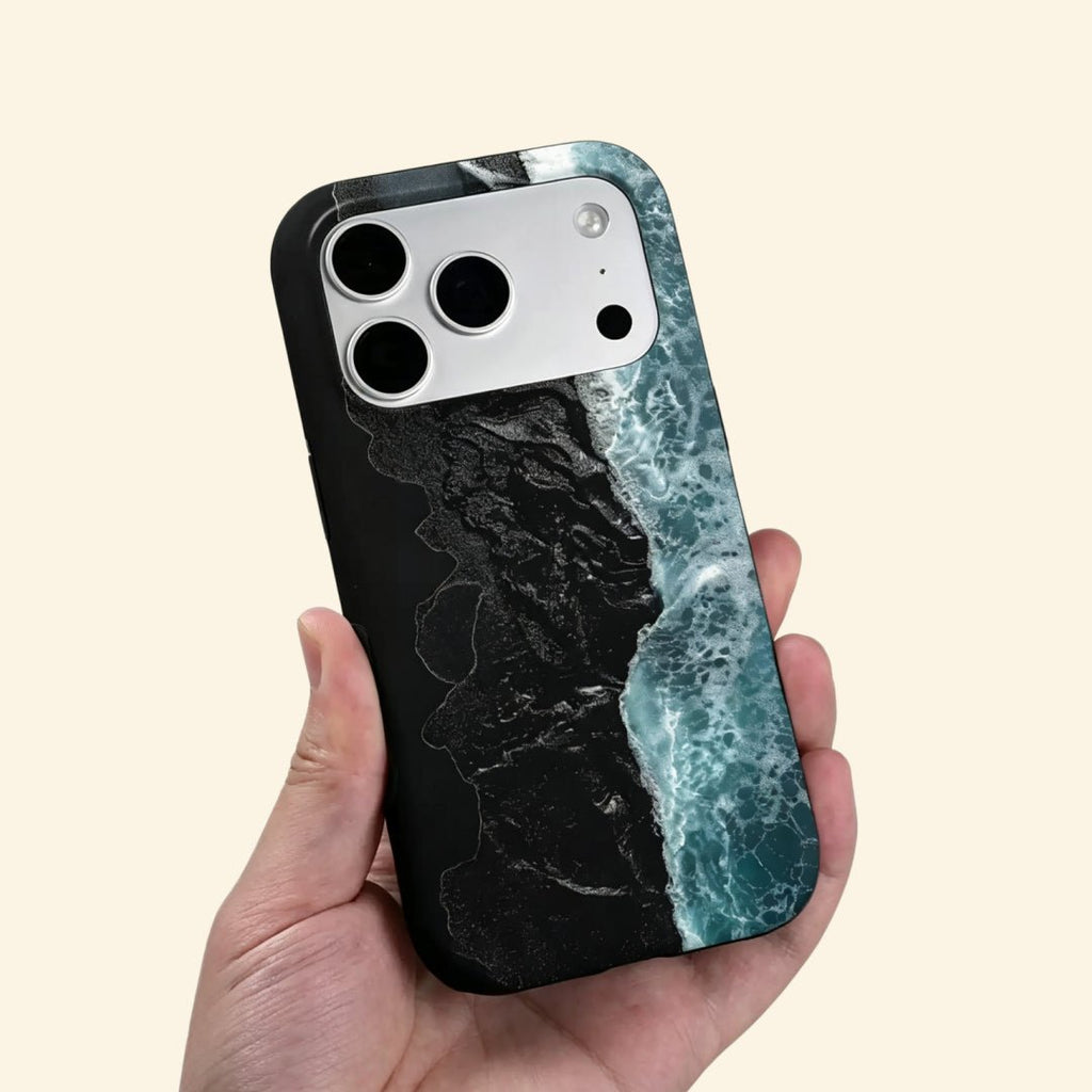 The Basalt Shore – Volcanic Black Sand & Ice-Blue Sea iPhone Case - Carapace StudioPhone CaseCarapace StudioCarapace StudioCS-3626-BASALT-SHORE-5iPhone 16 Pro MaxThe Basalt Shore case – low-angle top-down view showing camera island and black sand wave foam detail