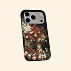 The Dutch Bouquet case – hand-held lifestyle shot showing full baroque floral still life with crimson poppies and wild daisies