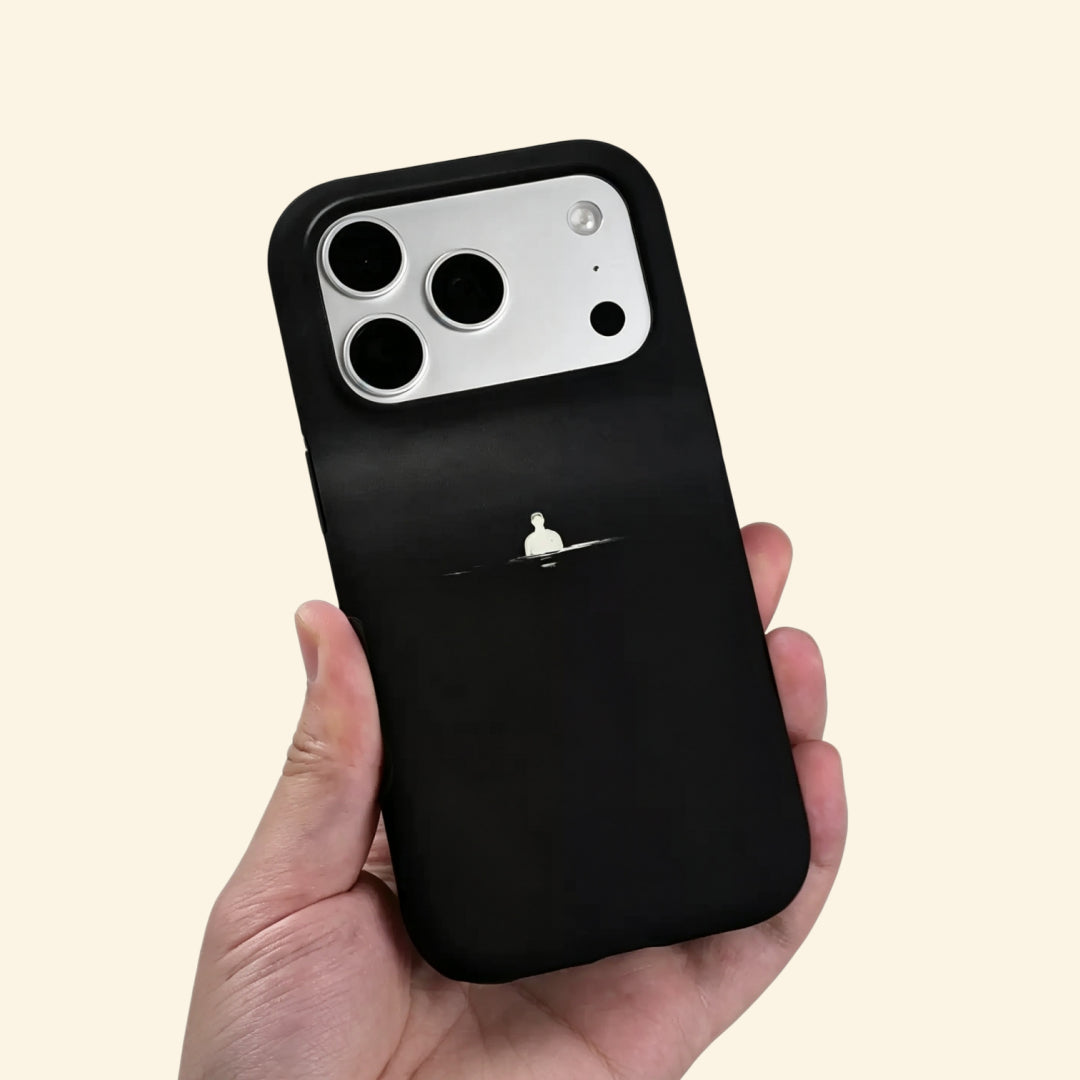 The Silent Void case – front flat lay with side profile showing full minimalist void artwork and dual-layer matte black shell