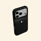 The Silent Void case – hand-held lifestyle shot showing solitary figure glowing against deep obsidian matte black
