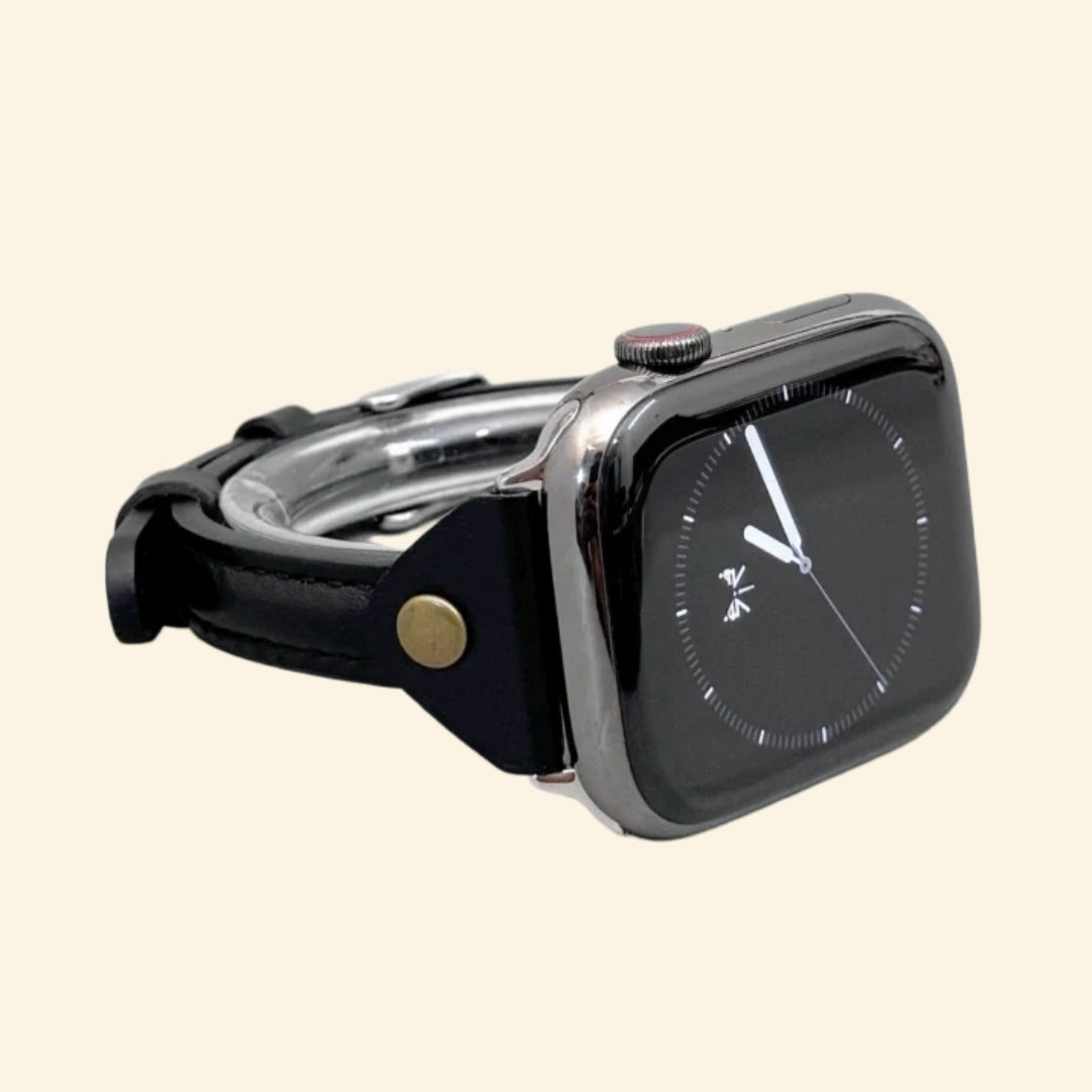 Obsidian Black Leather Band — rear sensor view with tang buckle on Apple Watch
