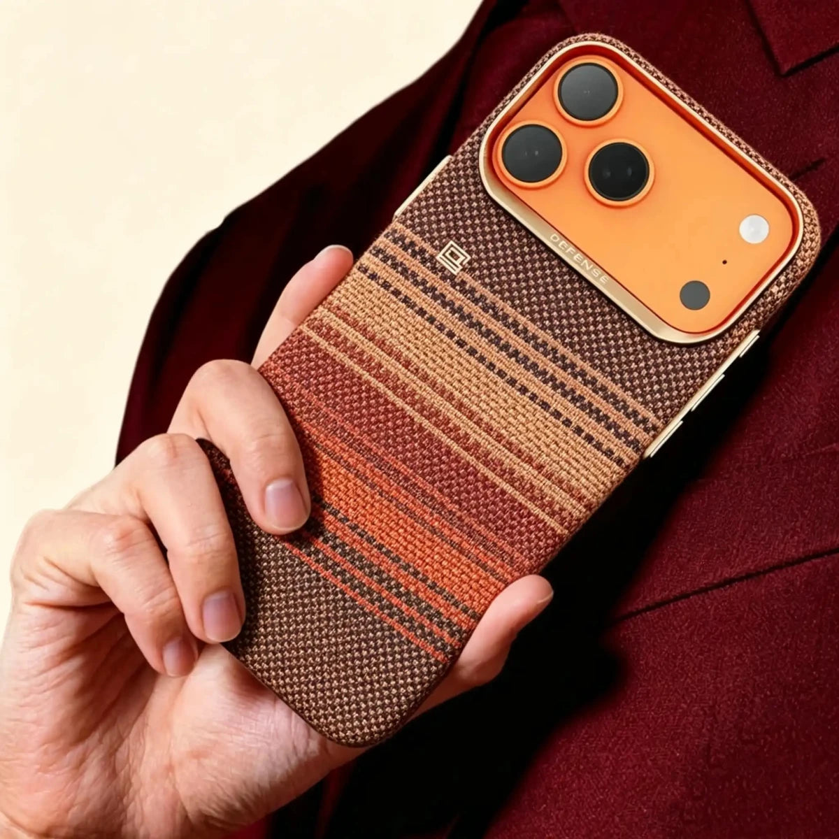 Specimen No. 10550 — Earthy Strata Gradient Aramid Case for iPhone - Carapace StudioiPhone CaseCarapace StudioCarapace StudioCS-10550-STRATA-1iPhone 17 Pro MaxSpecimen No. 10550 Strata Tapestry Aramid iPhone Case — lifestyle hand hold in burgundy suit
