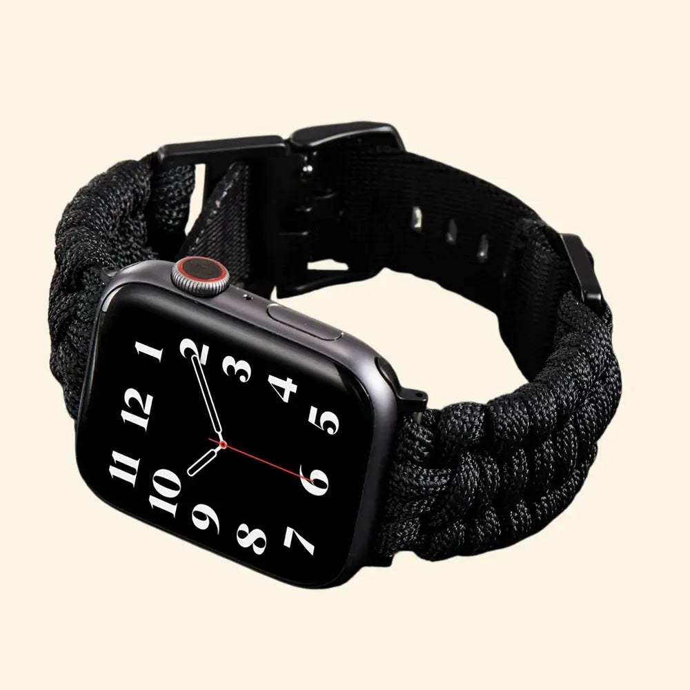 Stealth Black Paracord Braided Apple Watch Band — full band flat lay showing matte black buckle and lugs, Specimen No. 10010