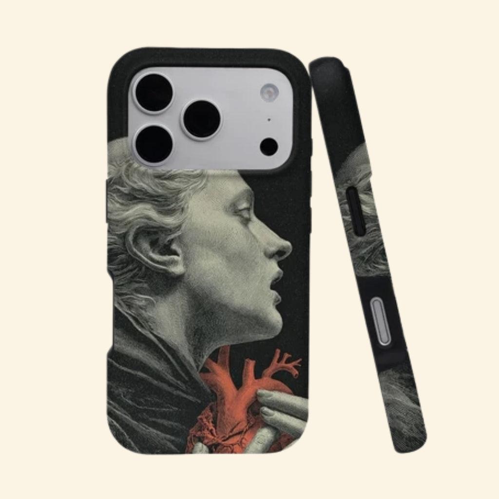 The Anatomy of Passion case – angled top floating view showing classical marble statue profile cradling vivid crimson anatomical heart on obsidian black
