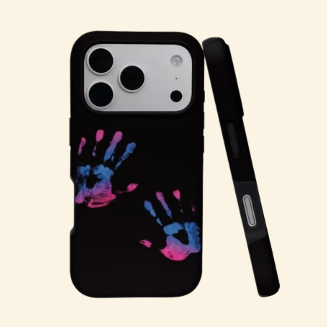 The Neon Impressions case – angled top floating view showing vivid magenta and cyan handprints on pitch-black matte