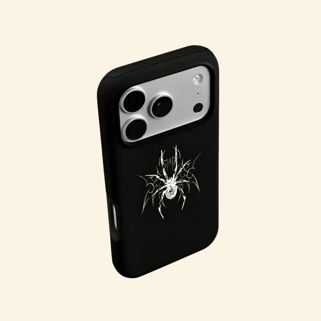 The Silver Arachnid case – low-angle side floating view showing camera island and razor-sharp silver arachnid detail