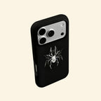The Silver Arachnid case – low-angle side floating view showing camera island and razor-sharp silver arachnid detail