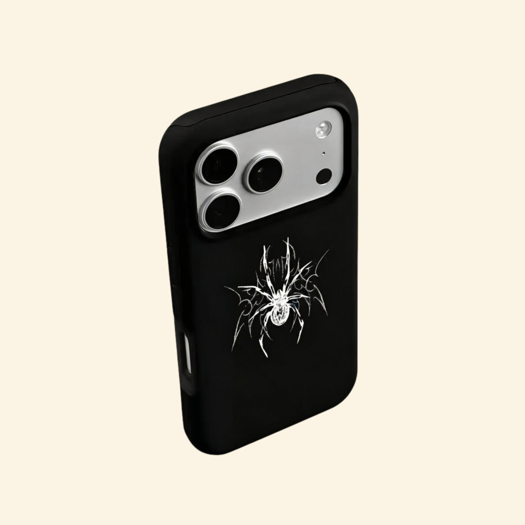 The Silver Arachnid case – low-angle side floating view showing camera island and razor-sharp silver arachnid detail