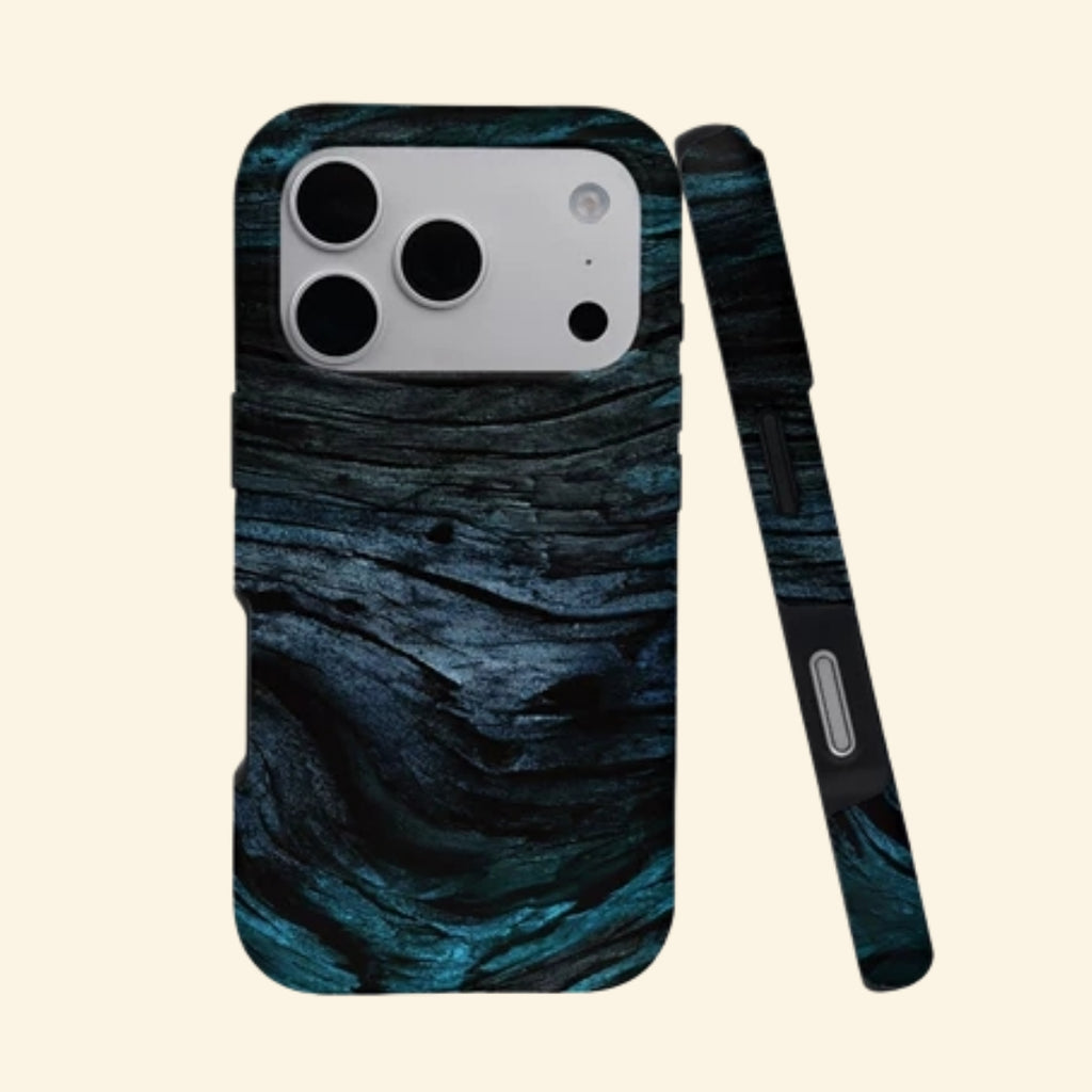 The Ancient Sediment case – angled top floating view showing rich dark wood grain with deep teal and cobalt undertones