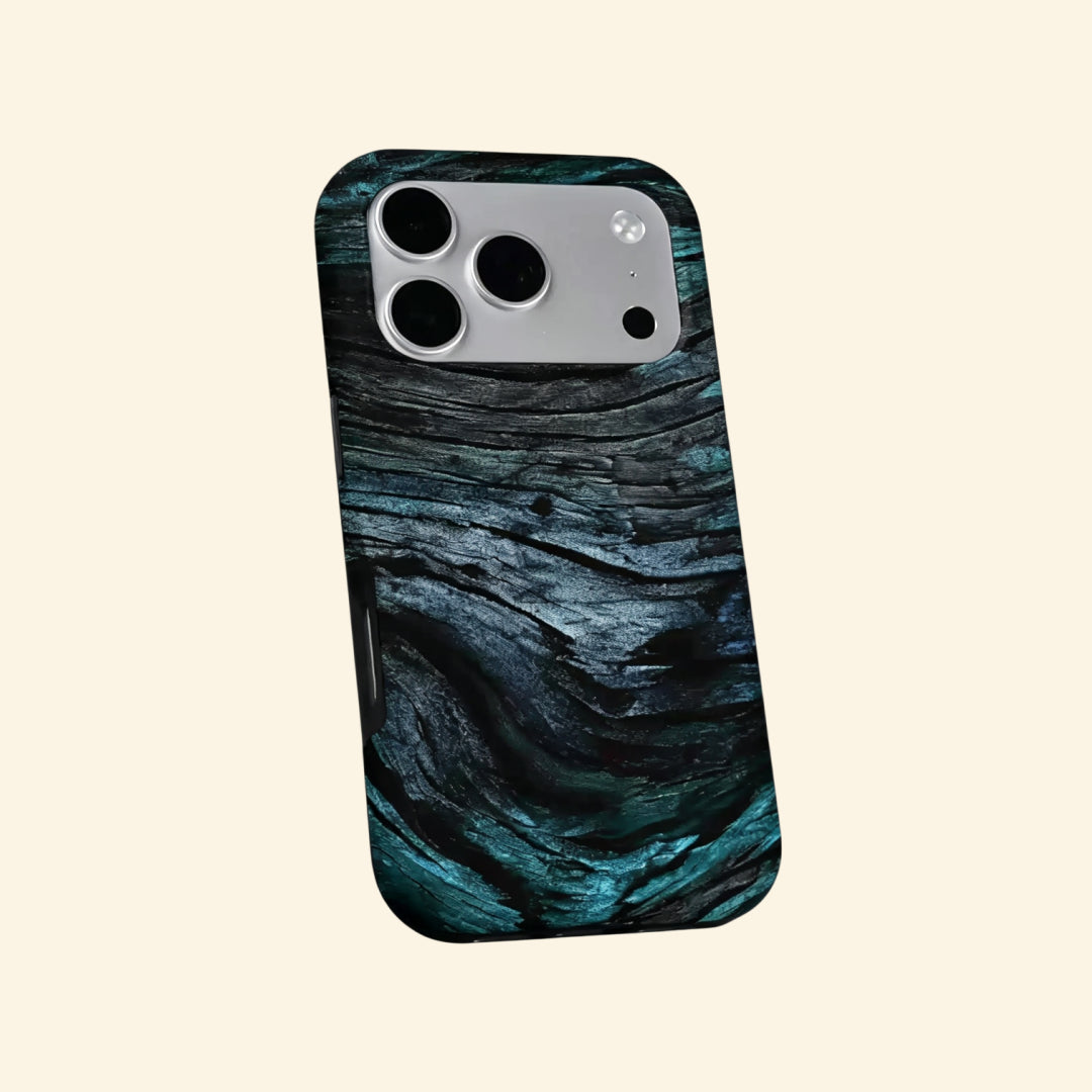 The Ancient Sediment case – flat lay back and side profile showing full-wrap petrified teal wood grain and dual-layer shell