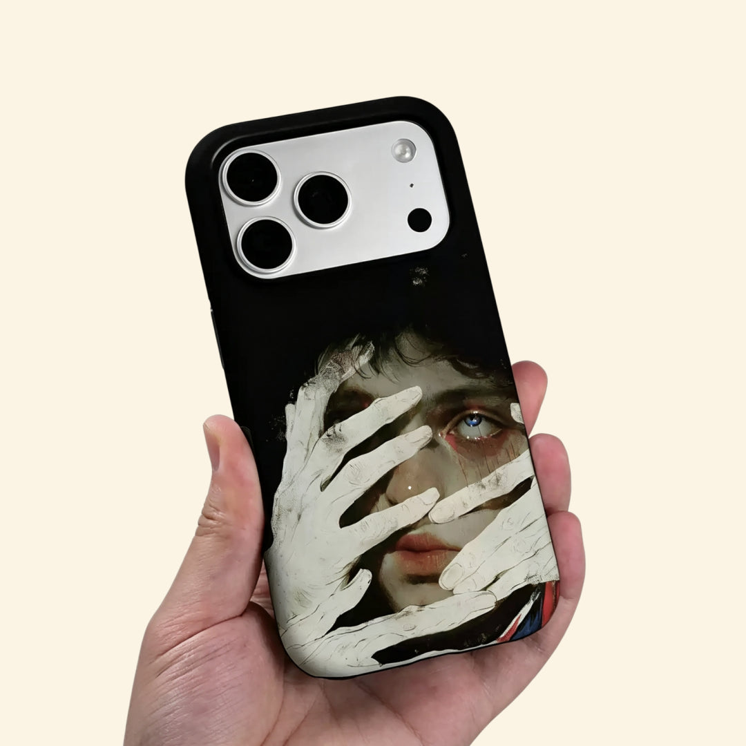 The Silent Gaze case – low-angle side view showing camera island and chalky pale hand detail with blue eye and crimson accents