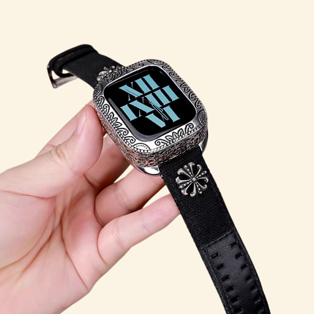 Baroque engraved gunmetal black Apple Watch case — front view showing full scrollwork bezel