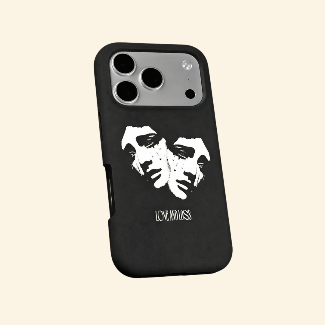 The Dual Tragedy case – hand-held lifestyle shot showing full weeping classical faces with Love and Loss gothic lettering