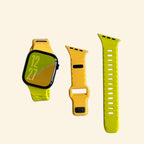 Volt Dual-Tone Apple Watch Band — watch with mustard and lime band, flat lay with components
