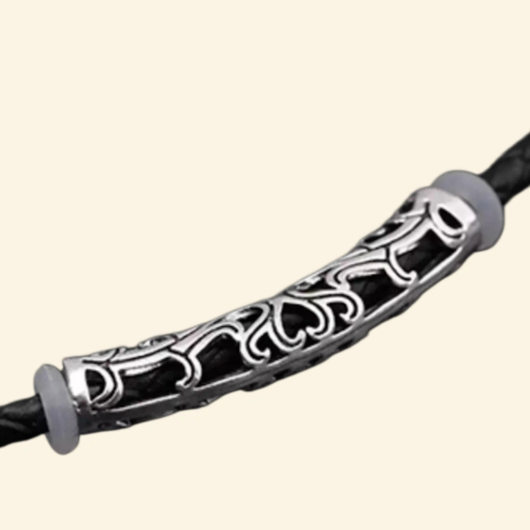 Tribal braided leather Apple Watch strap — close-up of brushed stainless steel fold-over clasp open, showing multi-strand leather cords, wooden beads, and silver bead accents