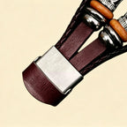 Burgundy braided leather Apple Watch strap — close-up of brushed stainless steel fold-over clasp open showing Apple Watch back sensor, multi-strand burgundy braid and wooden bead detail