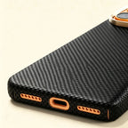 Specimen No. 10552 — Obsidian Gold Twill Aramid Case for iPhone - Carapace StudioiPhone CaseCarapace StudioCarapace StudioCS-10552-OBSIDIAN-GOLD-1iPhone 17 Pro MaxSpecimen No. 10552 Obsidian Gold Aramid iPhone Case — bottom USB-C port detail, black weave