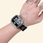 Baroque Archival Suite on wrist — silver engraved case with khaki canvas strap, roman numeral watch face