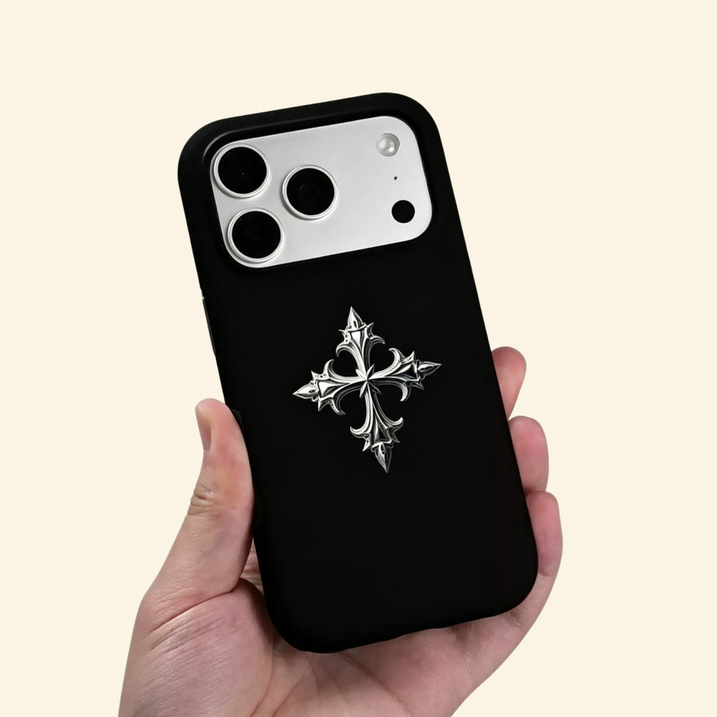 The Silver Relic case – hand-held lifestyle shot showing 3D metallic cross detail