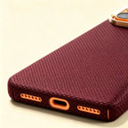Specimen No. 10555 — Burgundy Woven Aramid Case for iPhone - Carapace StudioiPhone CaseCarapace StudioCarapace StudioCS-10555-BURGUNDY-1iPhone 17 Pro MaxSpecimen No. 10555 Burgundy Woven Aramid iPhone Case — bottom USB-C port detail, burgundy weave