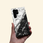 Monochrome Cracked Quartz Case — held in hand lifestyle shot